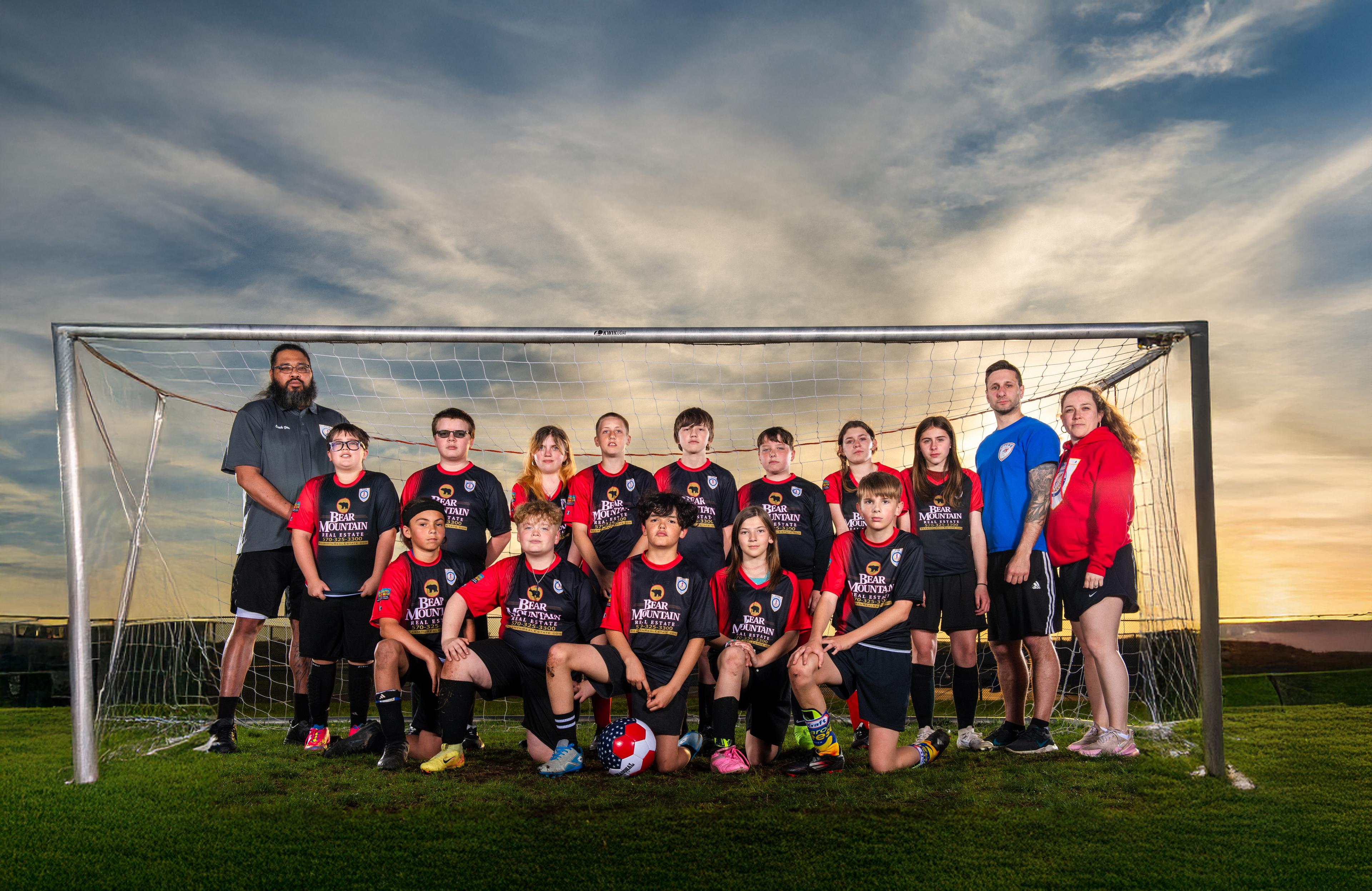 A soccer team posing for a photo.